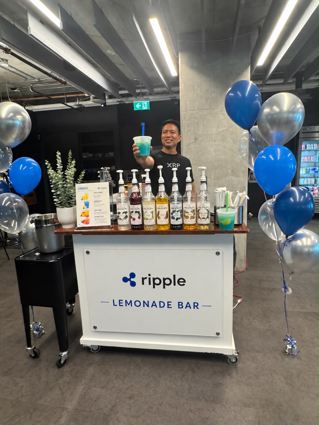 Ripple-branded lemonade bar with blue drinks and balloons